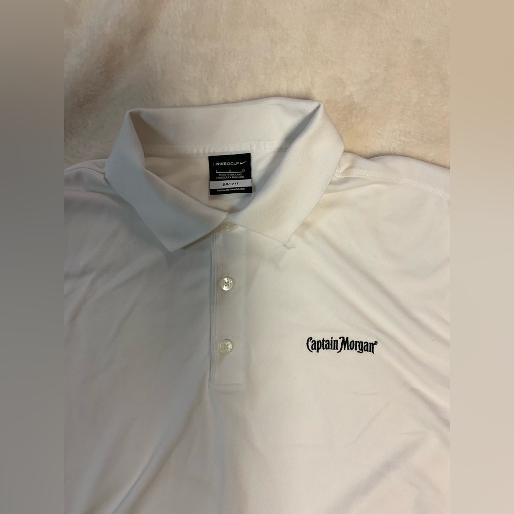 Nike Golf white Dri-Fit size large polo. Like new! Captain Morgan logo.